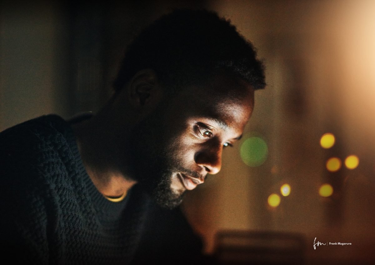 A creative working late by the light of a screen
