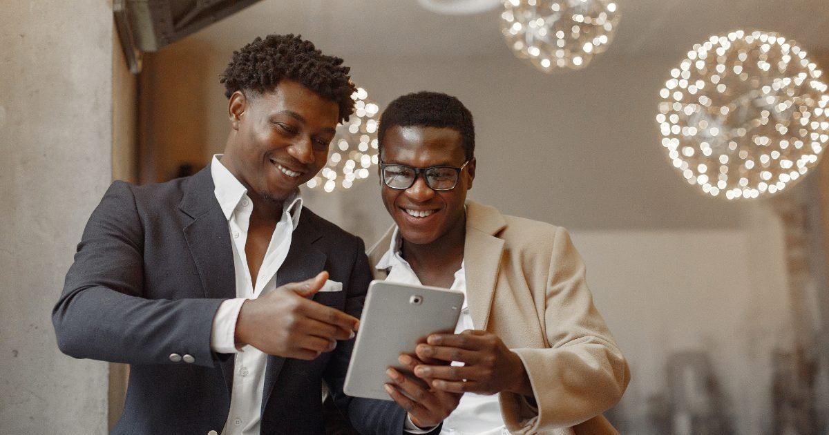 Two business partners reviewing their company dashboard together