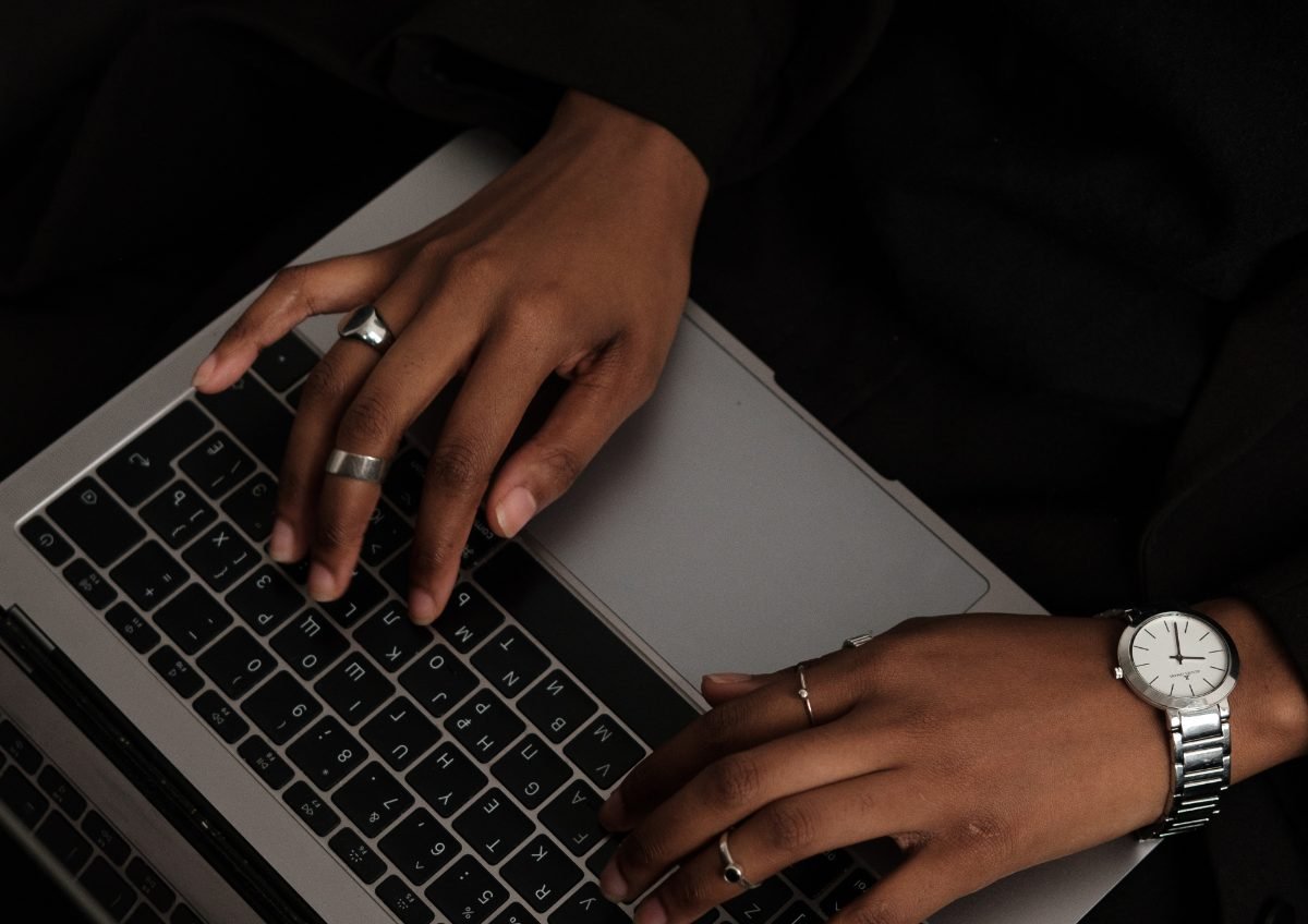 Hands working at a keyboard, building the systems behind the business